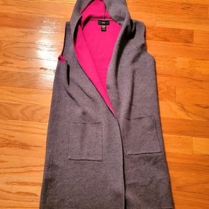Long, hooded knit vest with pockets